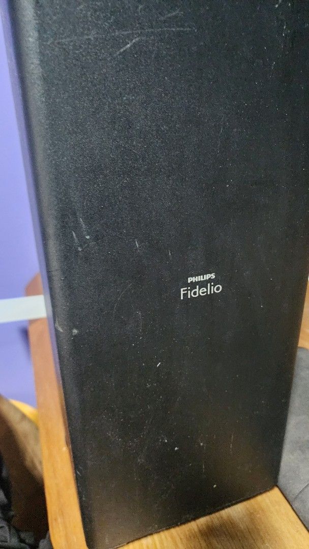 Philips Fidelio Soundbar plz read description (Category: Soundbars, Speakers & Amplifiers) located in Singapore. Submitted by fat-ben94 (Listing ID 1378239199, Image 2). Description: - Philips Fidelio soundbar and subwoofer included. - Used condition with some wear and tear (see photos). Suddenly stopped working, hold power got few secs than turns off, probably a capacitor or component issue, had static noise for awhile. Self collection only .