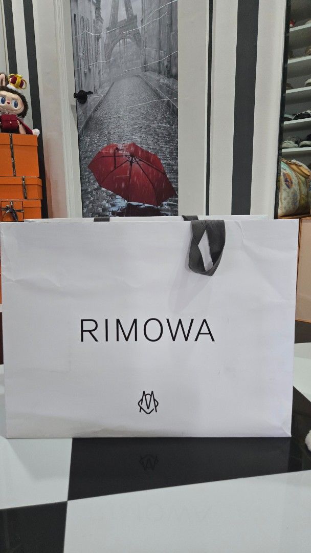 Rimowa Paperbag Biggest size (Category: Luxury Bags & Wallets) located in Manila. Submitted by primrepublic (Listing ID 1378176434, Image 2). Description: Authentic Rimowa Paperbag used for rimowa carry on luggage Size: 63 x 48 cm.
