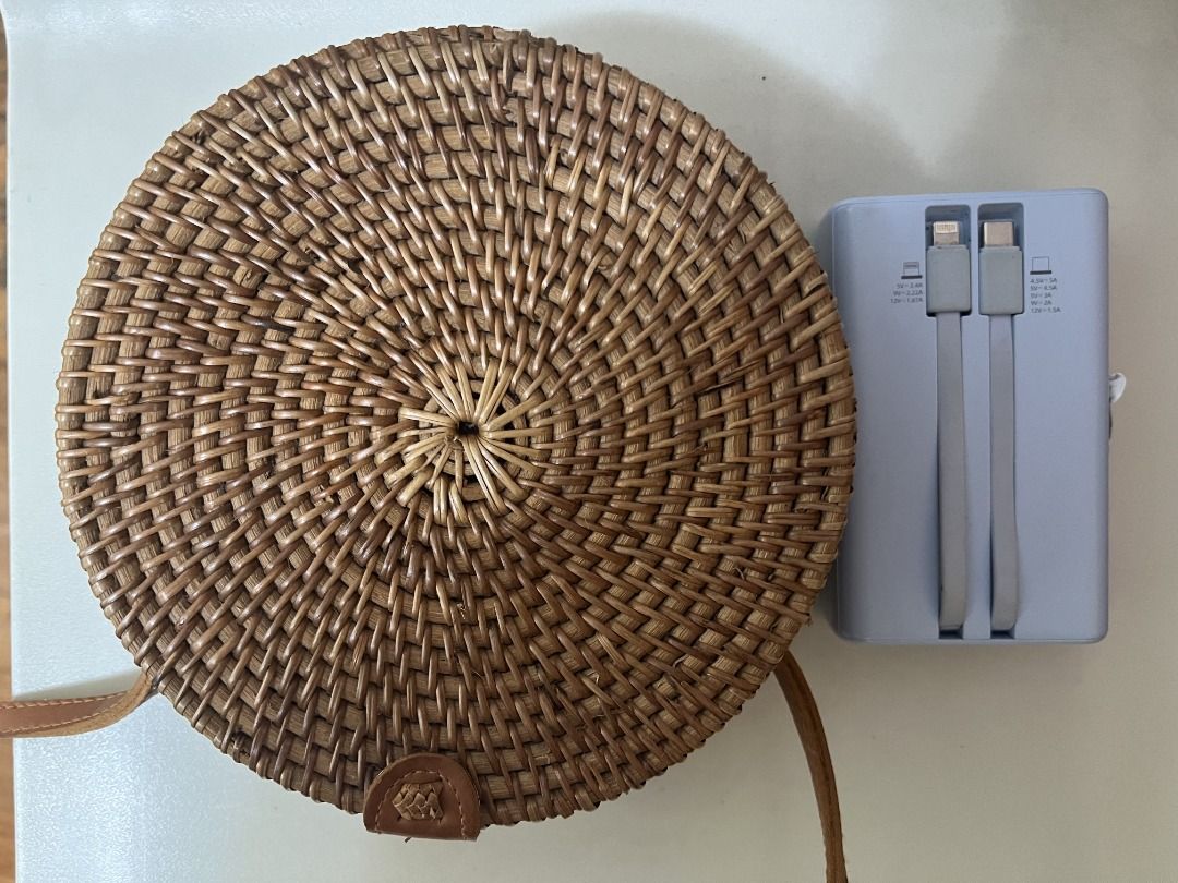 Round Circle Rattan Bag from Bali (Category: Cross-body Bags) located in Quezon City. Submitted by rinea (Listing ID 1378195442, Image 2). Description: - selling a round rattan bag purchased in Bali - crossbody type - never used outside, only tried to put things in - powerbank placed beside for size reference - can fit a 119 x 72 x 31.8 mm powerbank, iphone 13 and other essentials - send a msg if interested! thank you!.