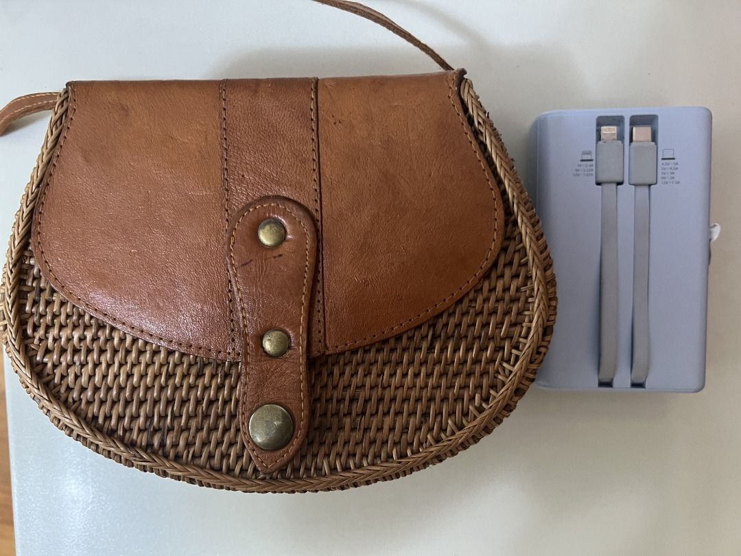 Round Wallet Rattan Bag from Bali (Category: Cross-body Bags) located in Quezon City. Submitted by rinea (Listing ID 1378194376, Image 3). Description: - selling a round wallet rattan bag purchased in Bali - unique design, crossbody type - never used outside, only tried to put things in - can fit a 119 x 72 x 31.8 mm powerbank, iphone 13 and other essentials - send a msg if interested! thank you!.