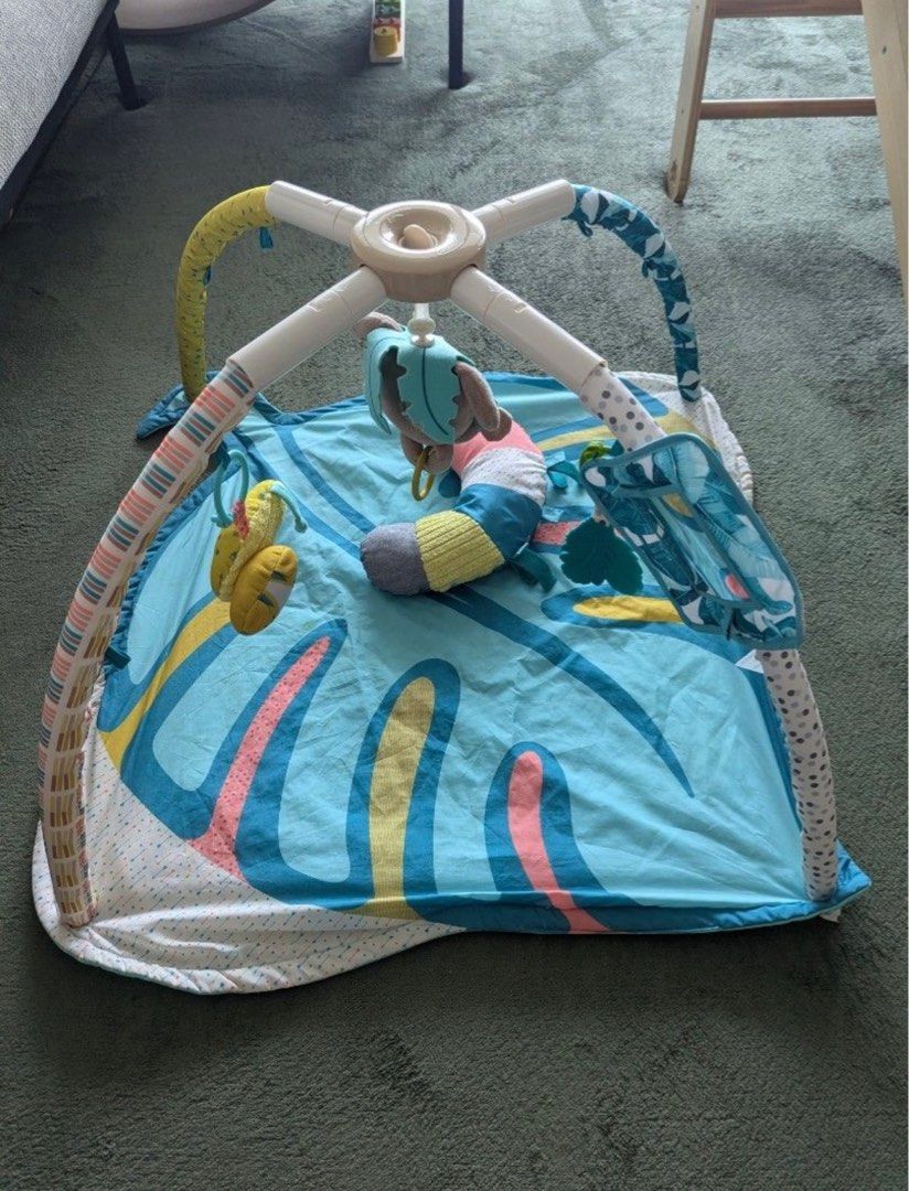 Skip Hop Explore & More Play Mat (Category: Infant Playtime) located in Singapore. Submitted by hceileen (Listing ID 1378181048, Image 3). Description: This Skip Hop play mat is in great condition, perfect for tummy time and playtime. It includes a variety of hanging toys and a mirror to stimulate your baby's senses. The mat is soft and comfortable, providing a safe space for your little one to explore..