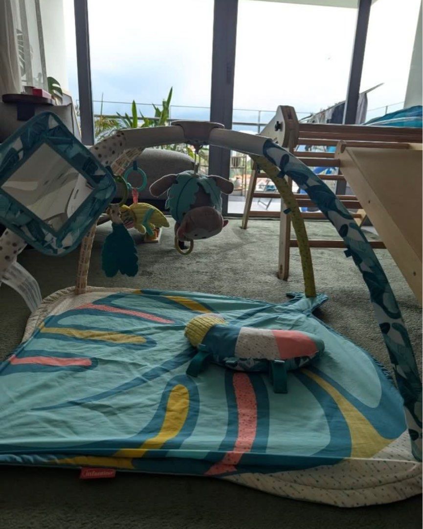 Skip Hop Explore & More Play Mat (Category: Infant Playtime) located in Singapore. Submitted by hceileen (Listing ID 1378181048, Image 1). Description: This Skip Hop play mat is in great condition, perfect for tummy time and playtime. It includes a variety of hanging toys and a mirror to stimulate your baby's senses. The mat is soft and comfortable, providing a safe space for your little one to explore..
