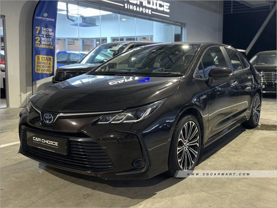 Toyota Corolla Altis Hybrid 1.8 (A) (Category: Used Cars) located in Singapore. Submitted by sgcarchoicewc (Listing ID 1378305514, Image 2). Description: 1 owner Solid condition Low maintenance Low fuel consumption High demand sedan Flexible loan available Warranty and servicing provided Huge boot space.