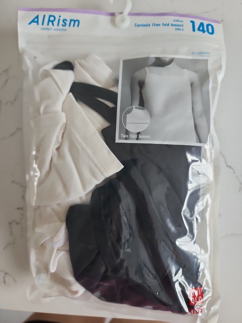 Uniqlo Airism Kids Tank Top - Size 140 (Category: Babies & Kids Fashion) located in Singapore. Submitted by fatshaman (Listing ID 1378233928, Image 3). Description: - New, unopened Uniqlo Airism Kids tank tops - Available in white and black - Size 140 - Perfect for layering or wearing alone - Comfortable and breathable material - Ideal for everyday wear.