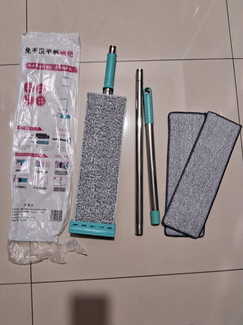 由 a09652474133869 (刊登 ID 1381826877，圖片 1) 提交，位於 高雄市 (Kaohsiung) 的 刮板拖把 (類別：清潔工具)，說明：送兩片拖片。