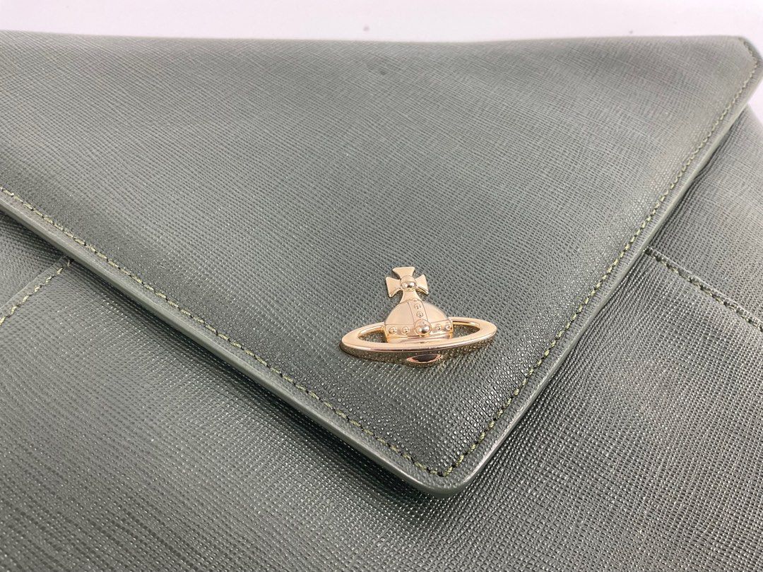 Auth Vivienne Westwood clutch (Category: Luxury Bags & Wallets) located in Caloocan City. Submitted by siftedthriftedph (Listing ID 1381846054, Image 2). Description: Authentic Vivienne Westwood Victoria envelope clutch So chic and elegant Excellent condition lightly cushioned L-10.2in x H-6.7in.