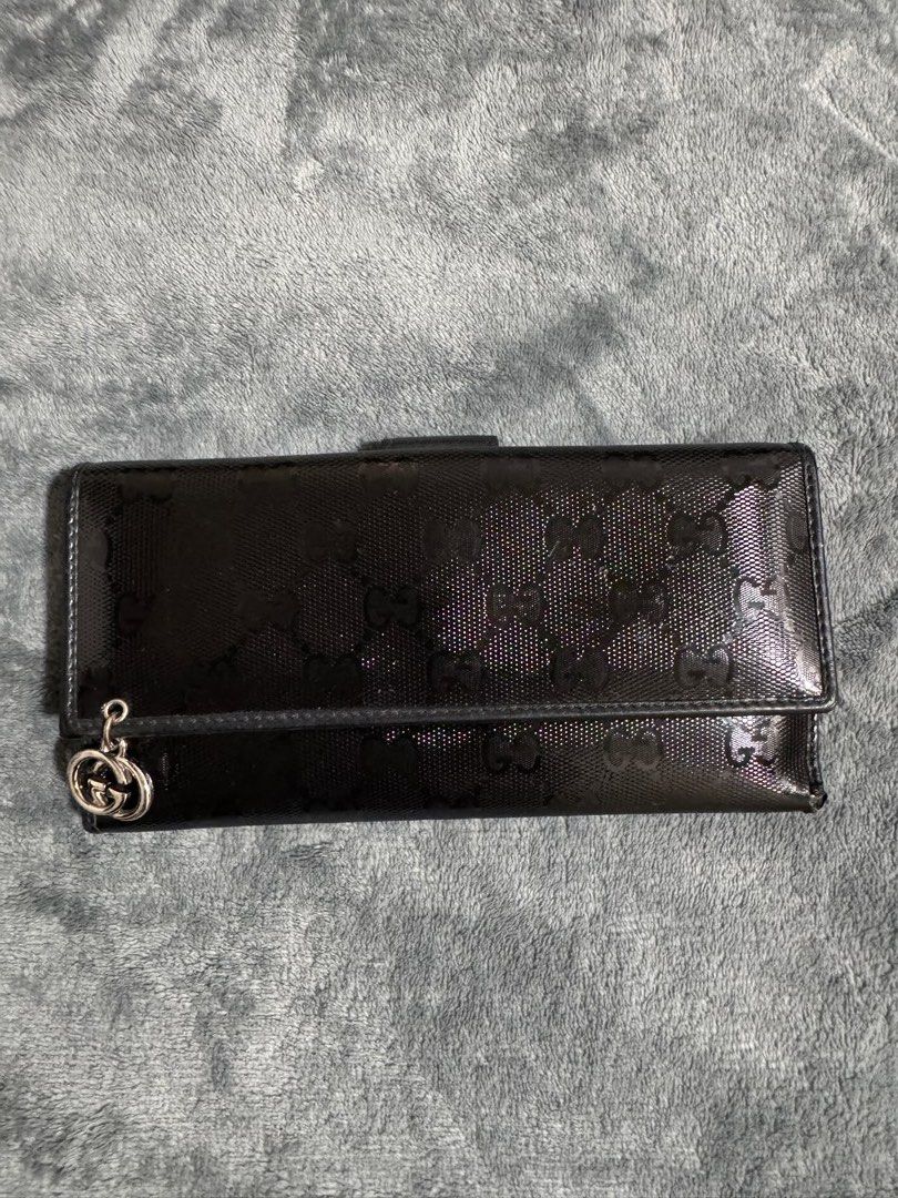 Authentic Gucci Guccissima Long Wallet Black (Category: Luxury Bags & Wallets) located in Bacoor. Submitted by crissxcross.ph (Listing ID 1381712764, Image 1). Description: Available for meetup at Ortigas (weekdays) and Bacoor (weekends). Available for shipping via Lalamove only. Payment Method: Gcash or Cash upon pickup or upon delivery (via Lalamove purchase service)..