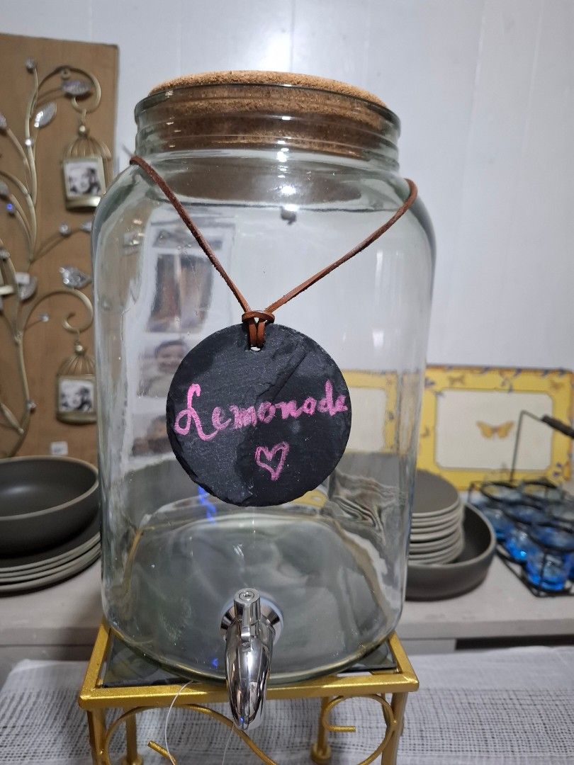 Juice/ water dispenser (Category: Pitchers & Dispensers) located in Makati City. Submitted by thedeclutteringabuela (Listing ID 1381699014, Image 1). Description: beverage server , with leather string and chalkboard from US . 2.5 gallons/ 9.4 liters. Good for parties. stand not included.