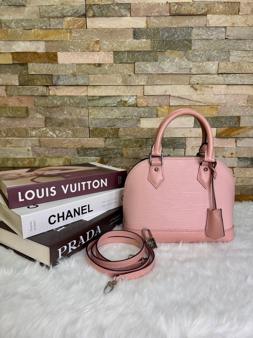 LV Epi Alma BB (Category: Luxury Bags & Wallets) located in Taguig. Submitted by angelbellaclaire (Listing ID 1381720529, Image 1). Description: “MINERS GONNA LOVE THIS 💕 Louis Vuitton Alma BB Epi Baby Pink (9.5/10) – Scratch-resistant Epi leather – With long strap for crossbody – Compact but spacious – Perfect for daily use or special dates!” 📐 Size: 9.8 x 7.5 x 4.7 inches 📦 Comes complete with lock, key, clochette & dustbag ‼️ VERY RARE COLO