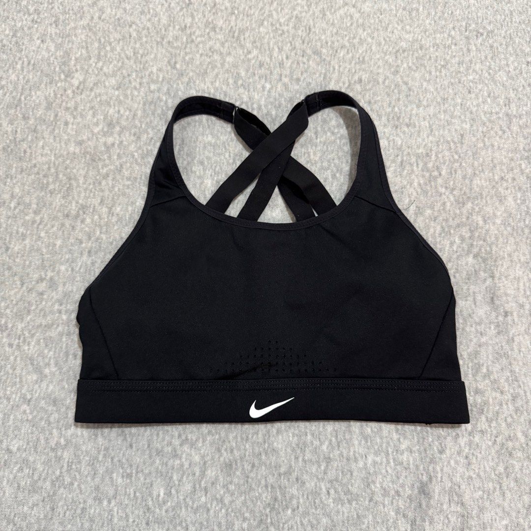 Nike sports bra (small) (Category: Activewear) located in Mabalacat. Submitted by amrcdo (Listing ID 1381724958, Image 1). Description: Nike sports bra in black size small on tag with built-in pads with complete tags! 🤩 criss cross back, super nice when worn 😍 like new condition! minor flaw: crack print on logo but only visible when super stretched!.