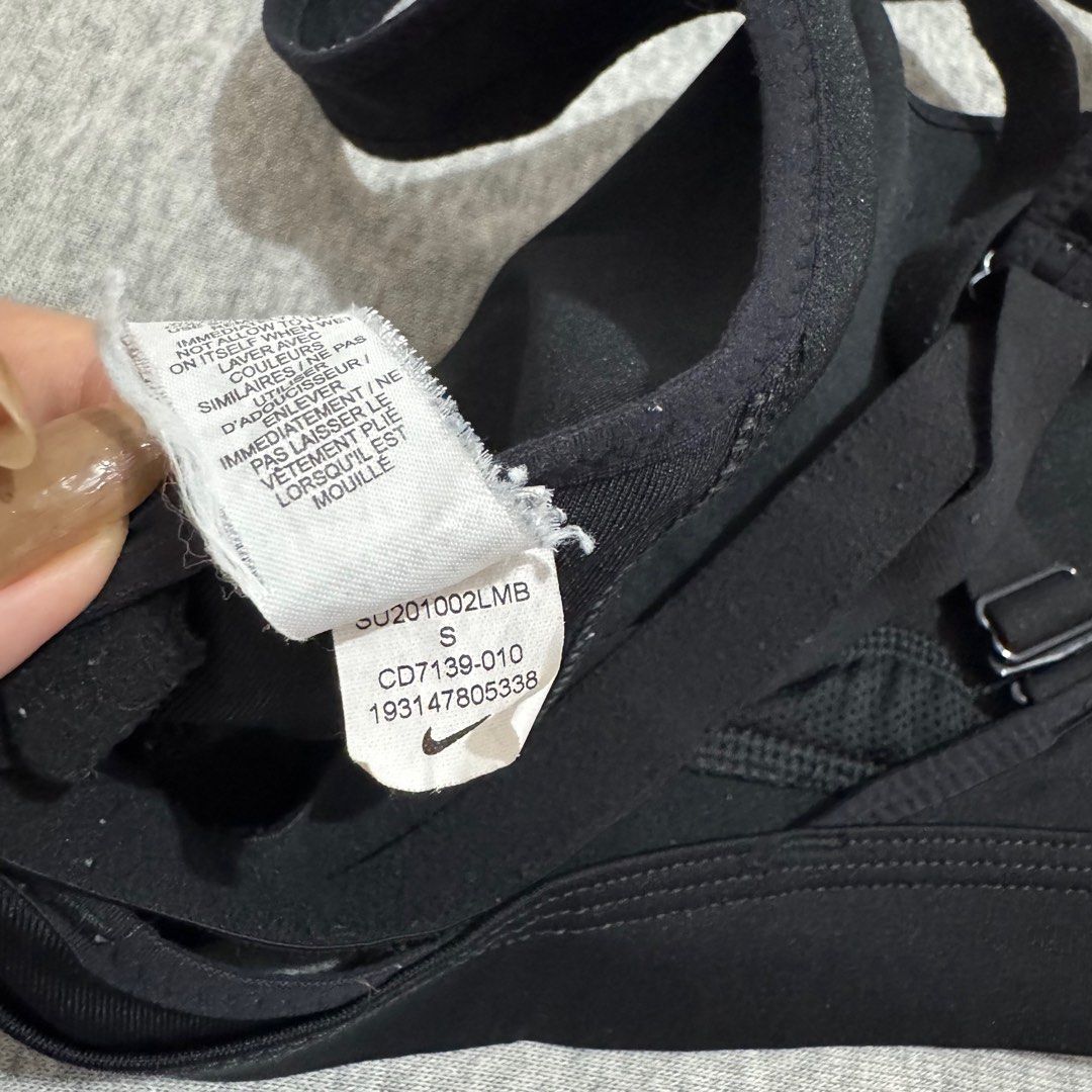 Nike sports bra (small) (Category: Activewear) located in Mabalacat. Submitted by amrcdo (Listing ID 1381724958, Image 3). Description: Nike sports bra in black size small on tag with built-in pads with complete tags! 🤩 criss cross back, super nice when worn 😍 like new condition! minor flaw: crack print on logo but only visible when super stretched!.
