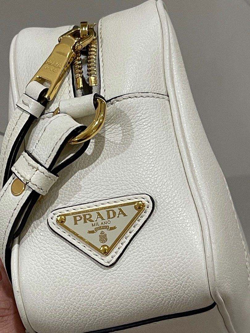 Prada White Jacquard Classic Embossed Camera Bag (Category: Luxury Bags & Wallets) located in Pasig City. Submitted by chescaaaaaaa.19 (Listing ID 1381832082, Image 3). Description: Selling my mother in law’s luxury bags for low prices (check other items! ❤️) Please read: * This is guaranteed 100% authentic. Selling low only because she has so many bags and needs the space. Most of the bags’ cloth bags and authenticity cards are already gone beca