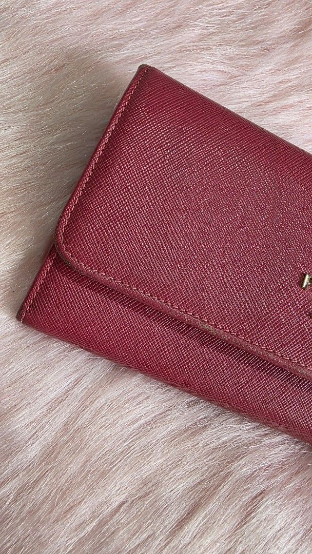 Pr@da long wallet (Category: Wallets & Card holders) located in Manila. Submitted by mpirerules (Listing ID 1381755330, Image 2). Description: Pr@da long wallet Heavily used Bought for Php10k Authenticity not guaranteed Still very useable See flaws in photos Do not buy if uncomfortable Price fixed, no more haggling RFS: Decluttering, need funds for ailing mother-in-law MOP: BDO/BPI/Gcash/Maya.