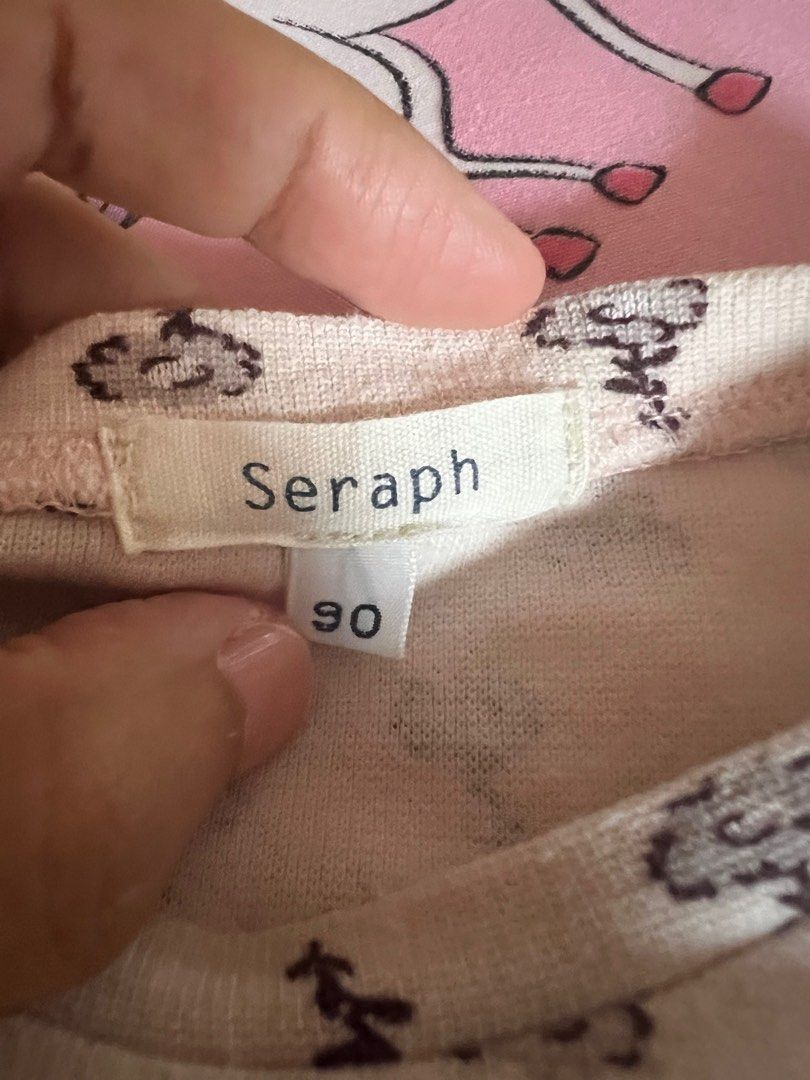 Preloved Seraph Top (Category: Babies & Kids Fashion) located in Makati City. Submitted by clutterbye (Listing ID 1381852928, Image 3). Description: Preloved - please manage your expectations Color may vary due to lighting PRICE IS FINAL, No Haggling Please Check Size Details in Pics RFS: Decluttering MOP: Gcash.