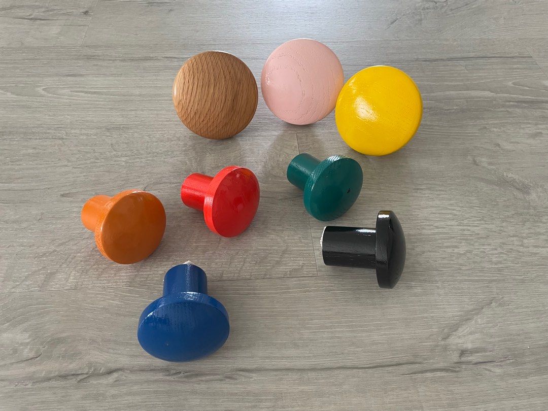 Wooden knobs for hanging (Category: Wall Decor) located in Singapore. Submitted by juniperseow (Listing ID 1381782979, Image 1). Description: Full set of colored wooden knobs to be sold as a bundle.