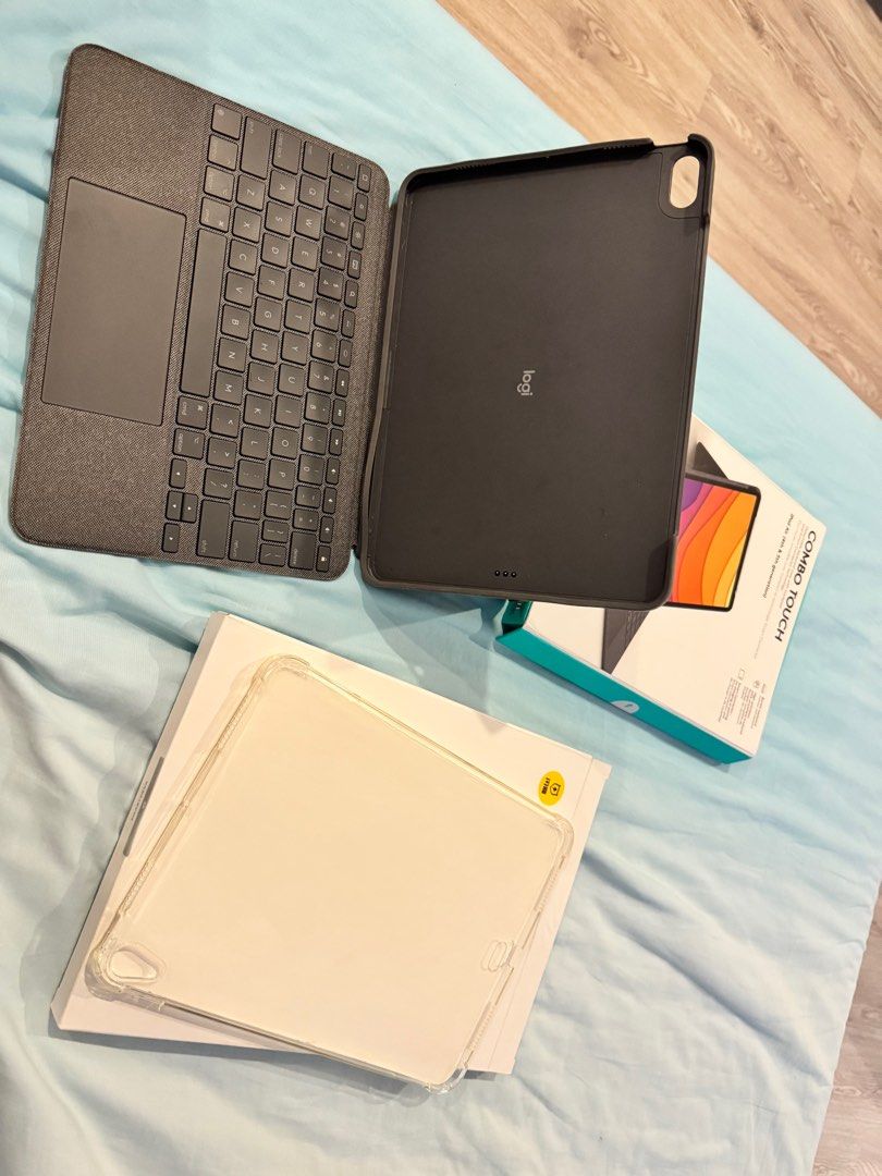 iPad Air 4th/5th Gen Cases - Logitech Combo Touch and Transparent Case (Category: Cases & Sleeves) located in Calamba. Submitted by _byagatha (Listing ID 1381937997, Image 3). Description: Logitech Combo Touch for ipad air 4th/5th gen - has signs of usage - keyboard is fully functional - case part is the only one with damage (see picture) - with free transparent case (unused) - price is slightly negotiable - rfs: need funds - payment first before