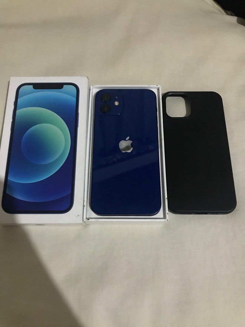 iPhone 12 128GB Midnight Blue Colorway (Category: iPhone 12 Series) located in Quezon City. Submitted by kaiven051921 (Listing ID 1381957326, Image 2). Description: iPhone 12 Midnight Blue Color 128GB Face ID Working True Tone Working Unli Reset Issue: Smart lock un lang Other than that sobrang kinis Comes with box case and ceramic tempered glass Location: Tandang sora QC.