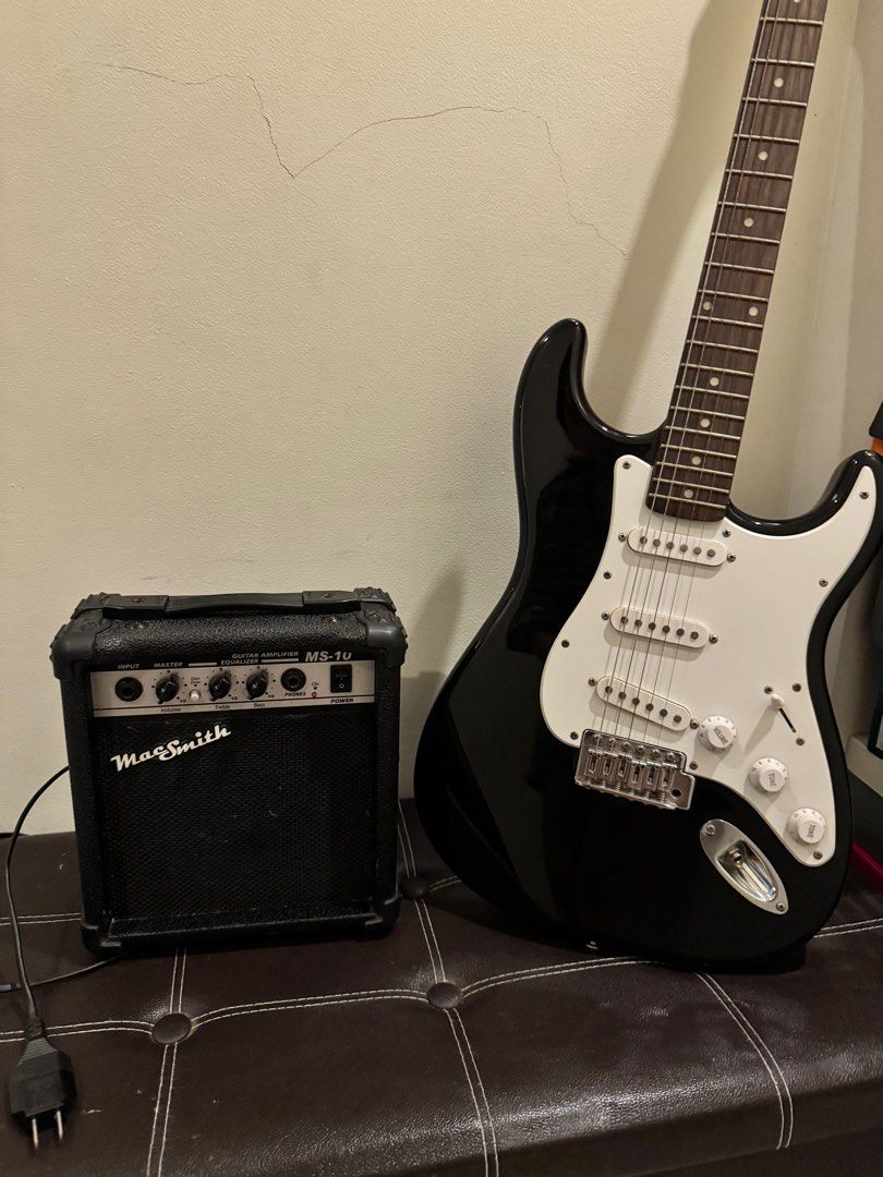 Macsmith Stratocaster Electric Guitar (Category: Musical Instruments) located in Lipa City. Submitted by mgracedue (Listing ID 1381978233, Image 1). Description: BATANGAS CITY LOC MacSmith Stratocaster Electric Guitar Fully functional hardware. Setup: Semi-low action 9 Gauge Strings Issues: Rusty Strings (no High E string) Small scratches Chipped Paint at the bottom MacSmith Guitar Amplifier MS-10 (10 Watts) Fully functional.