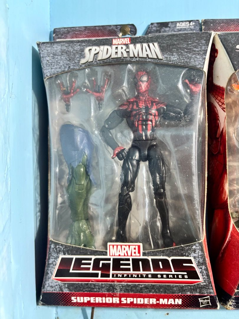 Marvel Legends Superior Spider-Man (MOC, BAF Part Included) (Category: Figurines & Statues) located in Imus. Submitted by ceeeentz (Listing ID 1381993428, Image 1). Description: Marvel Legends Infinite Series: Superior Spider-Man action figure by Hasbro. Sealed in original packaging Includes alternate hands and Green Goblin BAF piece Packaging has visible wear on top and bottom edges (see photo) .
