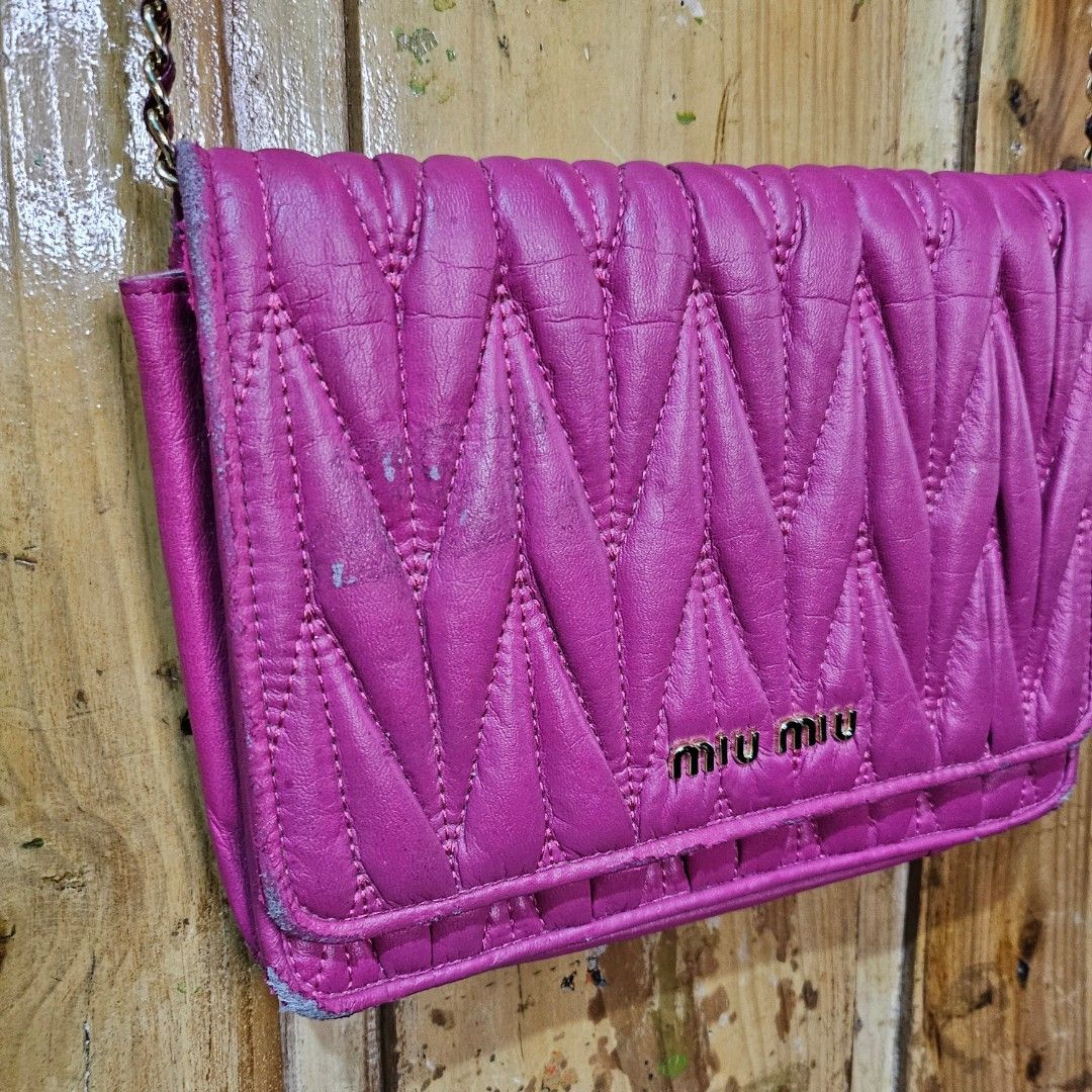 Miu Miu Sling Bag (Category: Luxury Bags & Wallets) located in Baguio. Submitted by goodfinds2600v2 (Listing ID 1381940373, Image 2). Description: Size: S Dimensions: L-6.5 W-9 Description: NGA Condition: Good Issue: rubs and leather peel, tape residue at the flop, no inside tag.