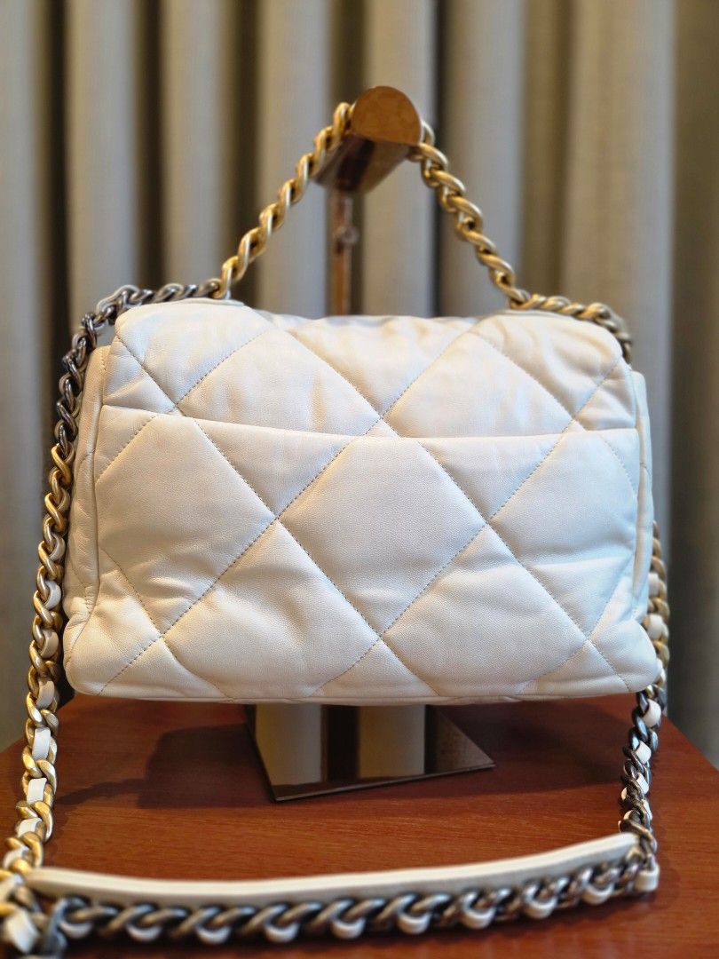 PL Chanel C19 Medium/large flap (Category: Luxury Bags & Wallets) located in Quezon City. Submitted by shop.mar.go (Listing ID 1381925311, Image 3). Description: preloved Chanel C19 lambskin series 30, hologram sticker intact white, tricolor hardware has minor dirt here and there but barely noticeable..