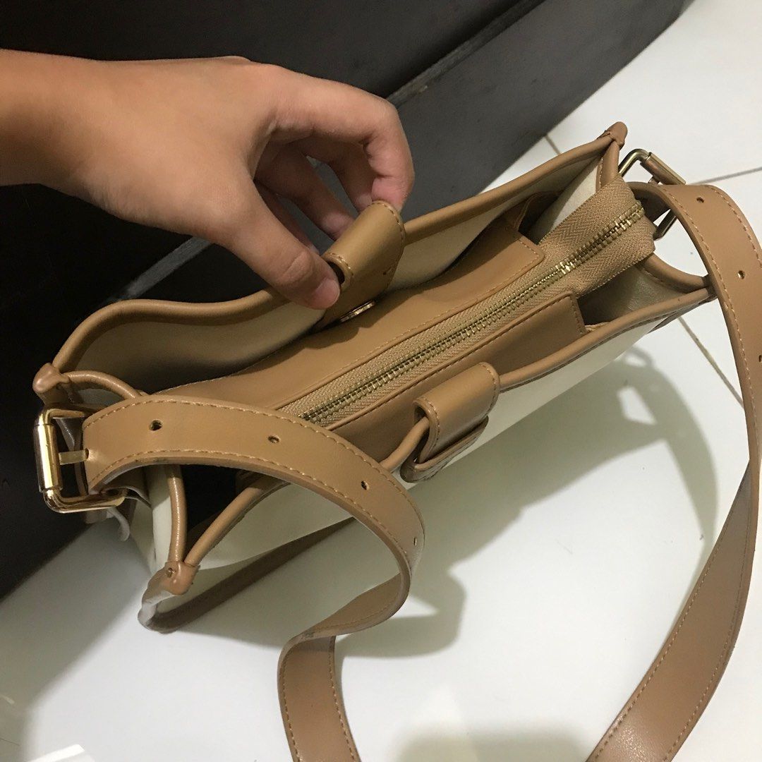 SANFU spacious bucket sling bag (Category: Cross-body Bags) located in Manila. Submitted by bbeeaa (Listing ID 1381954223, Image 2). Description: Leather material In good condition but with minimal issue (see 8th and 9th photo) Thrifted but used once only .