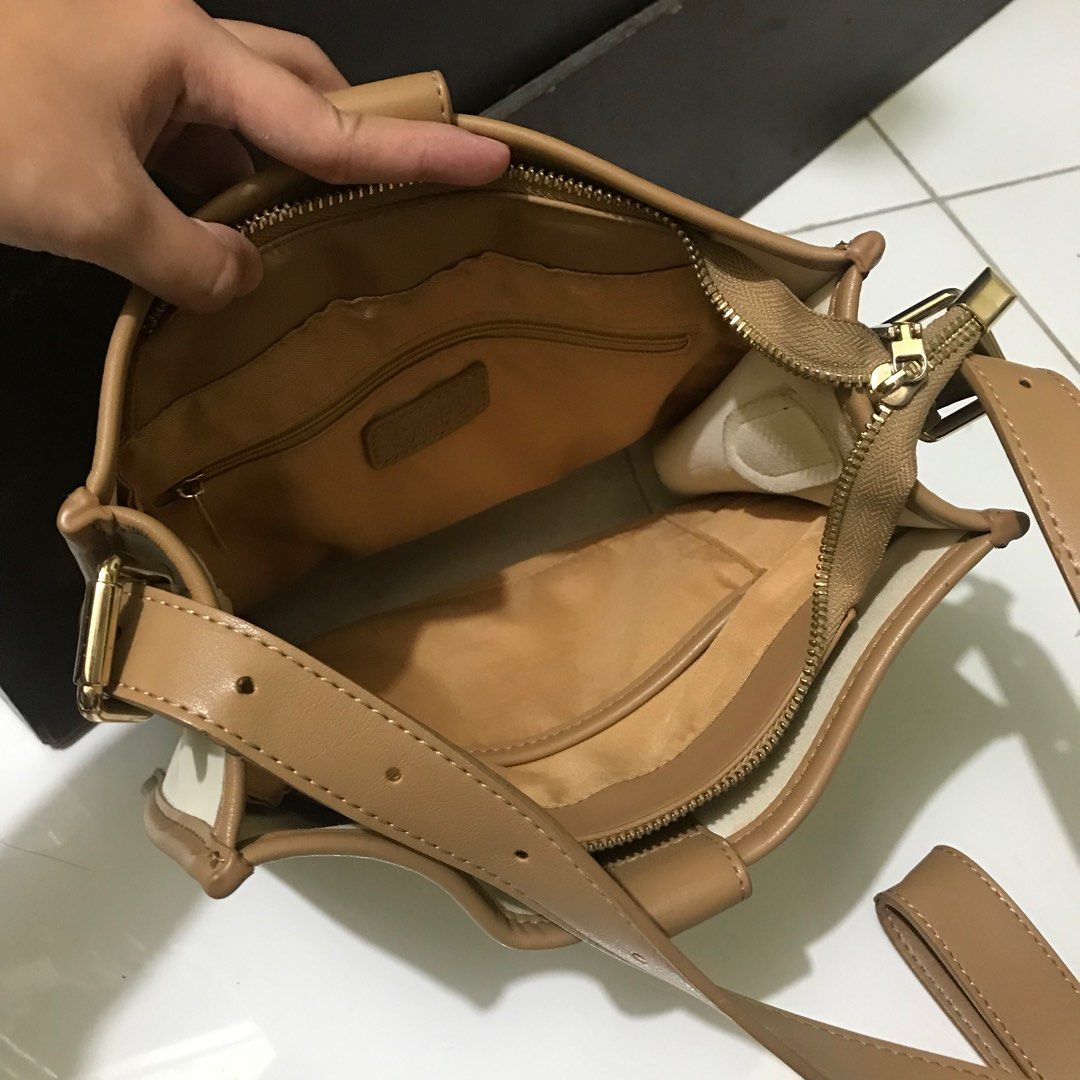 SANFU spacious bucket sling bag (Category: Cross-body Bags) located in Manila. Submitted by bbeeaa (Listing ID 1381954223, Image 3). Description: Leather material In good condition but with minimal issue (see 8th and 9th photo) Thrifted but used once only .