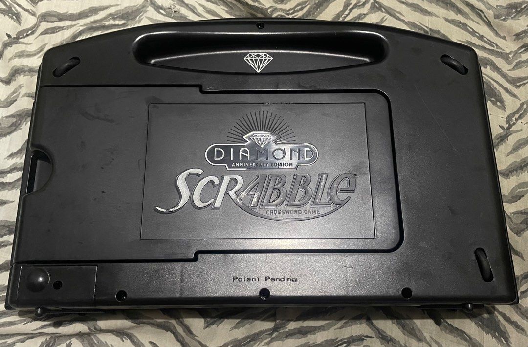 SCRABBLE DIAMOND ANNIVERSARY EDITION Black Tiles (Category: Board Games & Puzzles) located in Quezon City. Submitted by jackpotdecluttering (Listing ID 1382018596, Image 1). Description: SCRABBLE DIAMOND ANNIVERSARY EDITION Black Tiles - 90 letter tiles - 4 letter tray - 1 pocket bag - No hidden damages - No box included - WYSIWYG - For decluttering - Loc: Quezon City P3,000 .