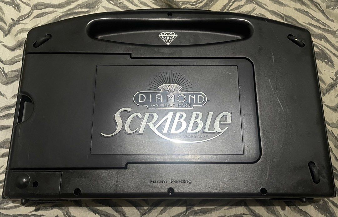 SCRABBLE DIAMOND ANNIVERSARY EDITION Black Tiles (Category: Board Games & Puzzles) located in Quezon City. Submitted by jackpotdecluttering (Listing ID 1382018596, Image 3). Description: SCRABBLE DIAMOND ANNIVERSARY EDITION Black Tiles - 90 letter tiles - 4 letter tray - 1 pocket bag - No hidden damages - No box included - WYSIWYG - For decluttering - Loc: Quezon City P3,000 .