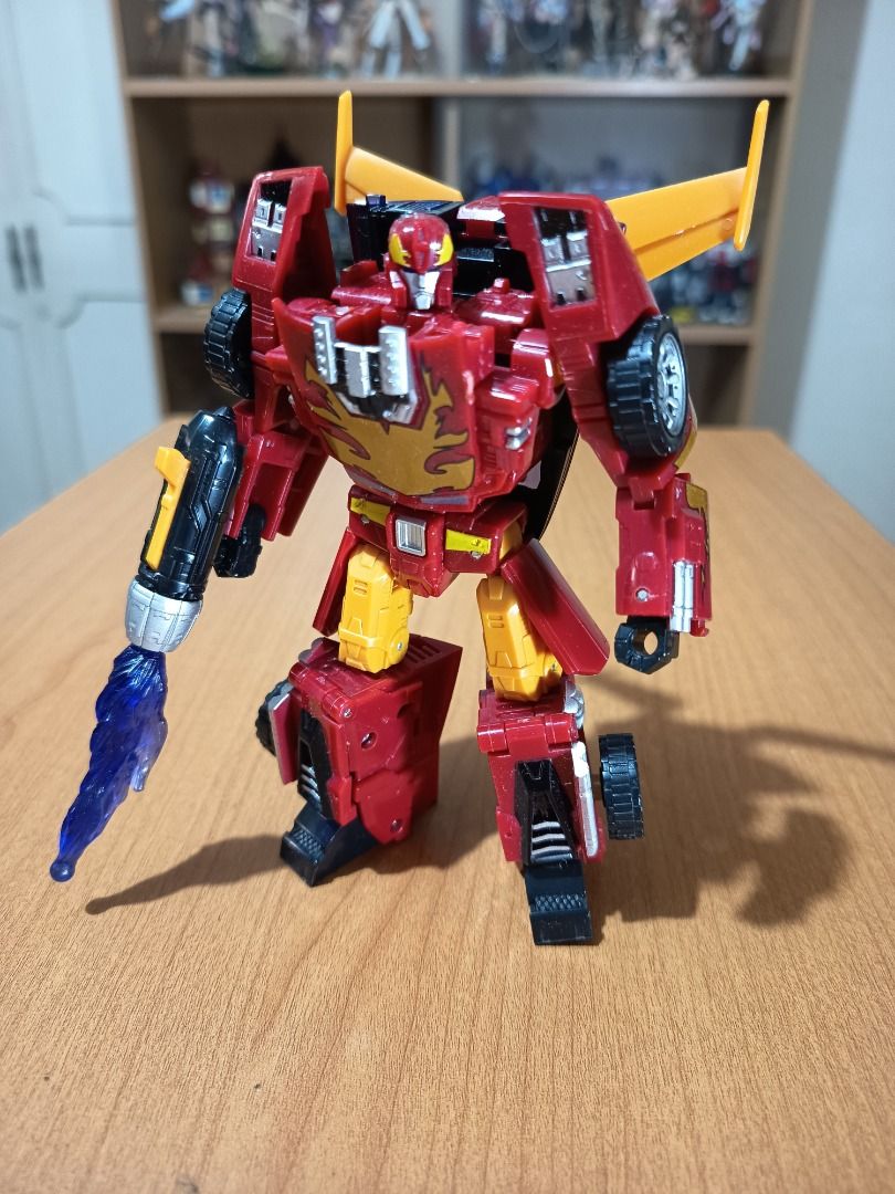 Transformers HOT ROD/RODIMUS (Hasbro, 2006) (Category: Action & Battle Toys) located in Paranaque City. Submitted by coolcollectorstuff (Listing ID 1382033283, Image 1). Description: Transformers Rodimus/Hot Rod (Deluxe Class) by Hasbro - Loose but in excellent condition - Complete accessories: gun/exhaust - Originally released in 2006.