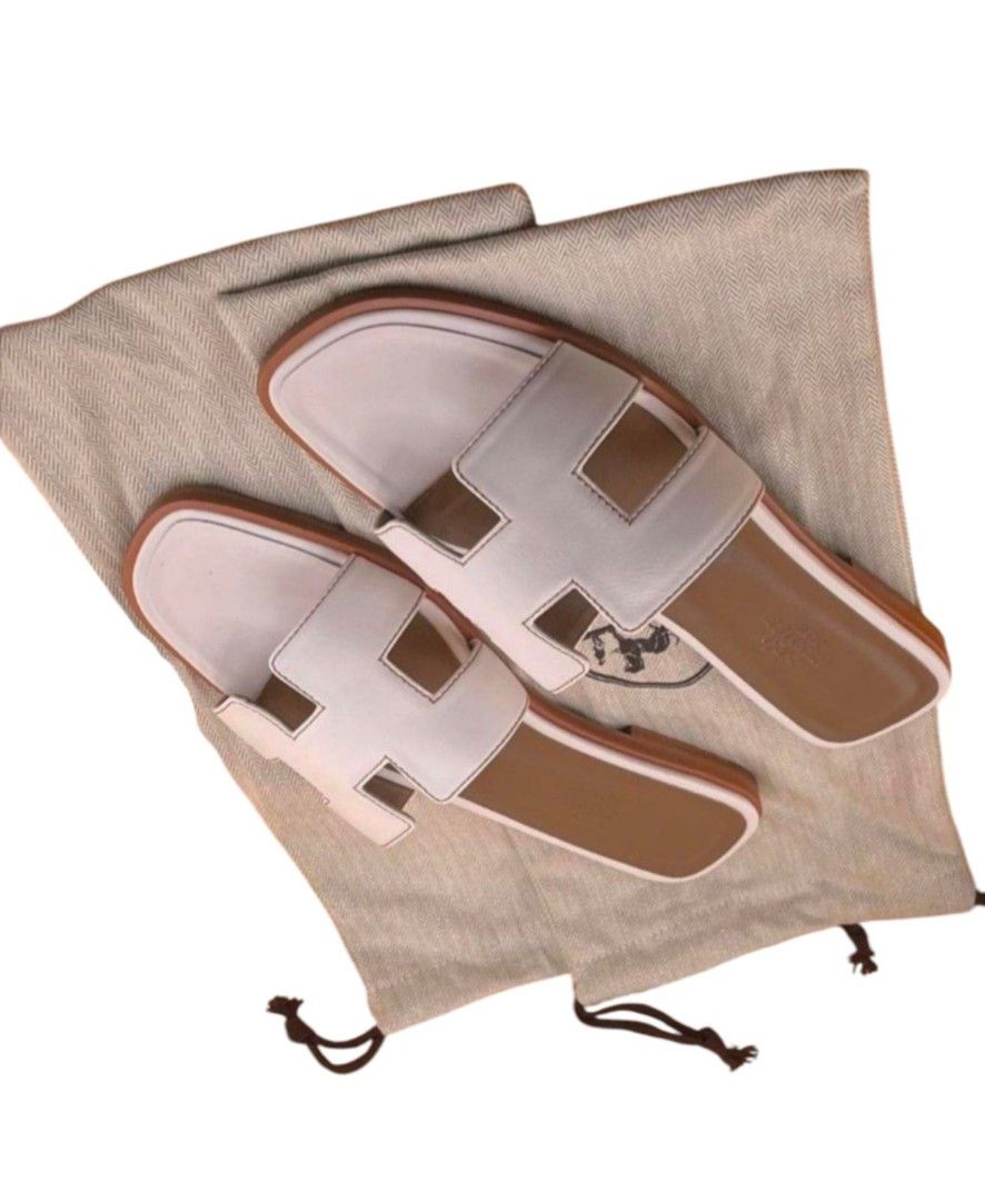 Authentic Hermés Oran Lambskin Classic White With Dustbag and Authenticity Document (Category: Sneakers & Footwear) located in La Trinidad. Submitted by designerluxeshop (Listing ID 1382277470, Image 3). Description: Pre-owned Hermés oran lambskin classic white with dustbag and authenticity documents size 39, 💯% original, in good condition, shipping is free, message me if interested, ready for delivery, in stock discount is offered for cash buye