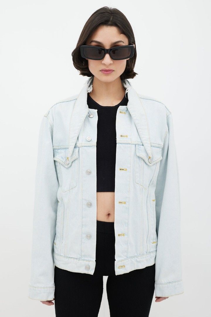 Balenciaga Light Wash Denim Jacket (Category: Luxury Apparel) located in Rosales. Submitted by simplebyx.ph (Listing ID 1382266837, Image 1). Description: Balenciaga Light Wash Denim Jacket featuring exaggerated collar with distressing, patch pockets at front, slit pockets at waist, button placket at front, contrast stitching throughout, chain detail at interior, and button closures at back hem. __________________ Size: 34 on tag perfect fit to M