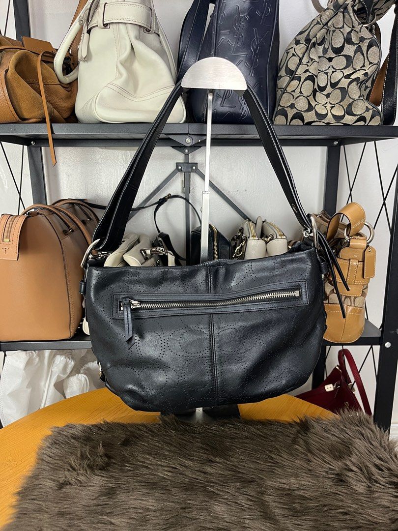 Coach Hobo Shoulder Bag with Perforated Logo (Black) (Category: Luxury Bags & Wallets) located in Quezon City. Submitted by eclipse.leandro (Listing ID 1382250121, Image 2). Description: Coach Hobo Shoulder Bag with Perforated Logo (Black) Condition: 9/10 24cm x 14.5cm 3,500 PHP Issue: no coach tag All products are 100% Authentic bought from Japan. Disclaimer: We are not affiliated with the brands listed. #LuvLuxe #LuxuryJPNFinds.