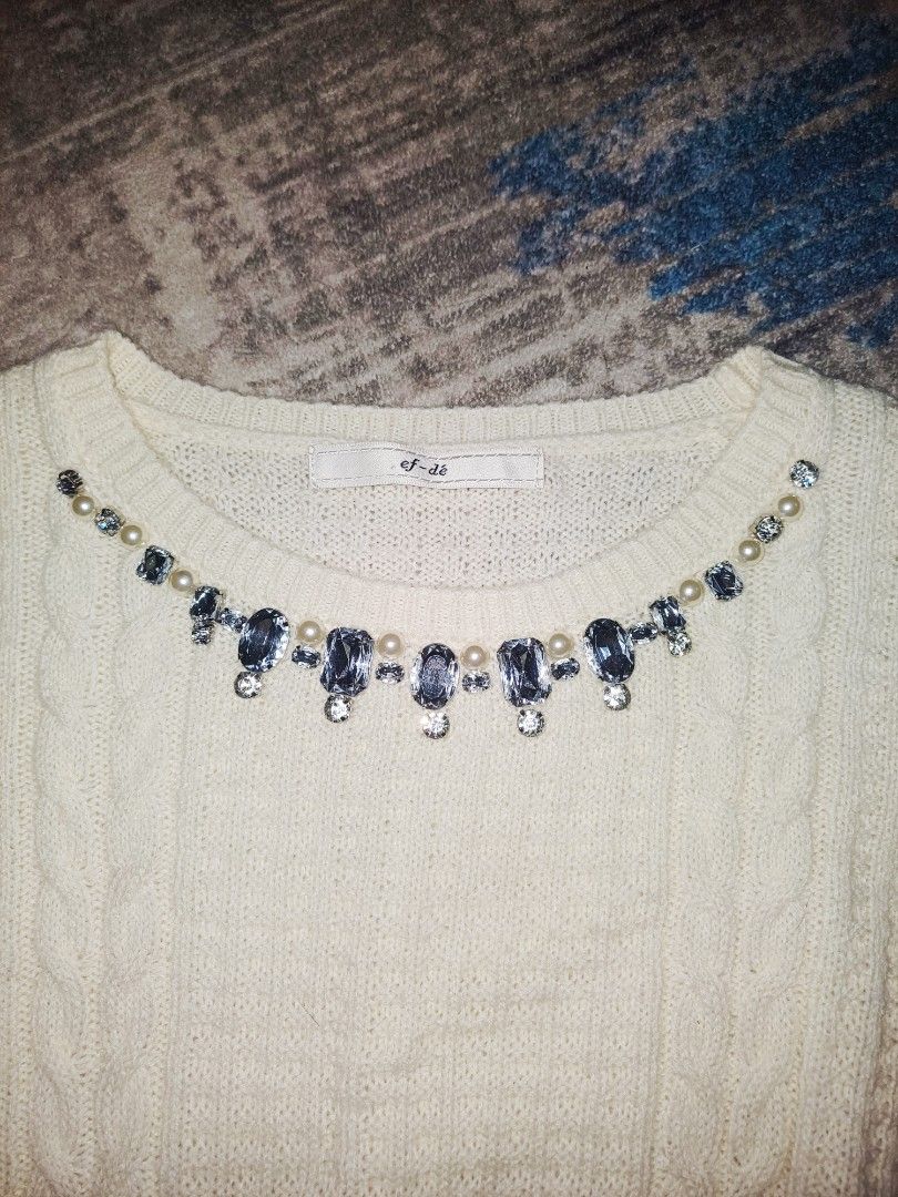 Knitware (Category: Coats, Jackets and Outerwear) located in Nilai. Submitted by acheek (Listing ID 1382226429, Image 3). Description: ✨ Elegant White Knit Sweater with Pearl & Rhinestone Details | ef-dé (Japan Brand) 📏 Size: Best fit for Small to Medium / Petite 🎀 Condition: Like new – worn once, very well kept 🧶 Material: Soft thick knit, comfy and warm 🎨 Color: Creamy white 💎 Neckline embellished with faux pearls & rhinestones – classy an