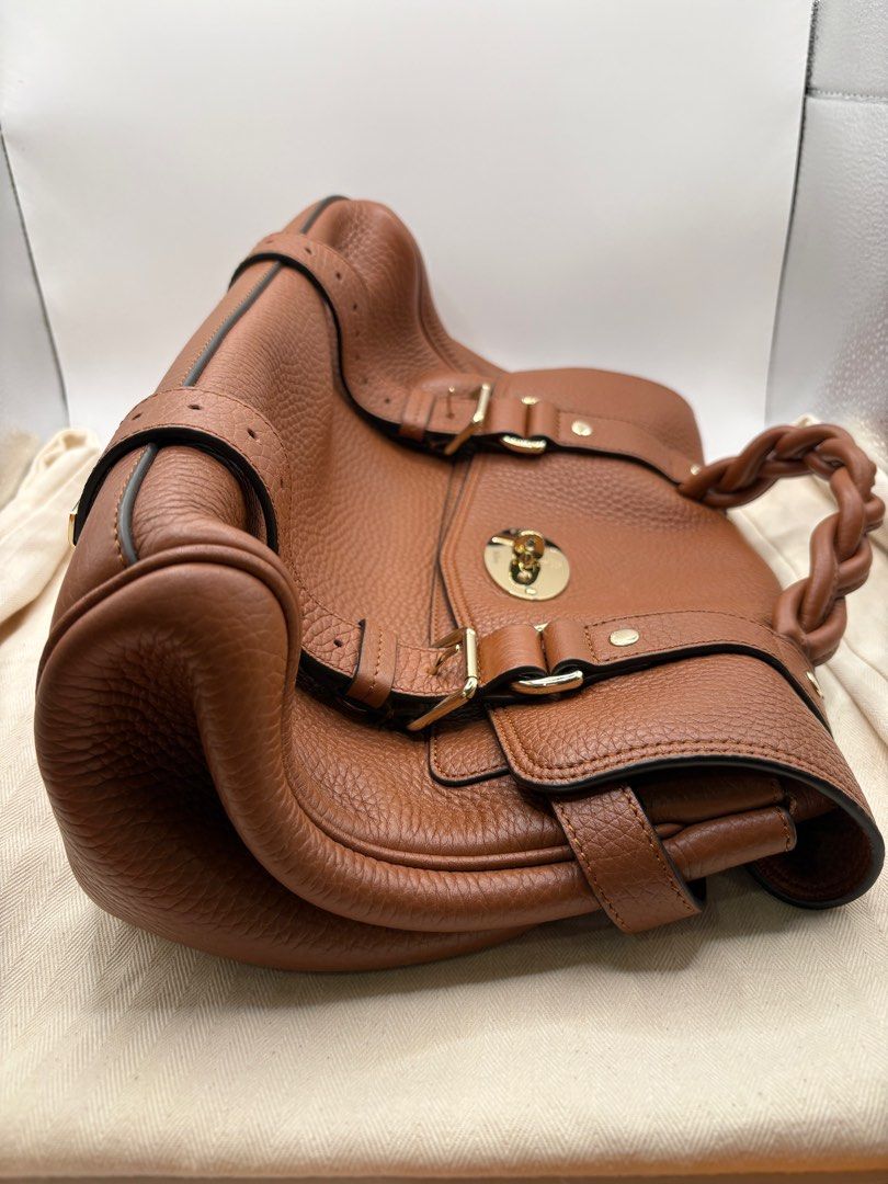 Muberry Alexa Bag New Version (Category: Luxury Bags & Wallets) located in Manila. Submitted by summercookie (Listing ID 1382274592, Image 3). Description: Used a few times Color: Chestnut An iconic Mulberry bag with braided top handle and double strap closure. Postman’s Lock closure Handcrafted braided top handle Adjustable leather shoulder strap for crossbody wear One main compartment Internal slip pocket Soft gold component finish Unlined Heig