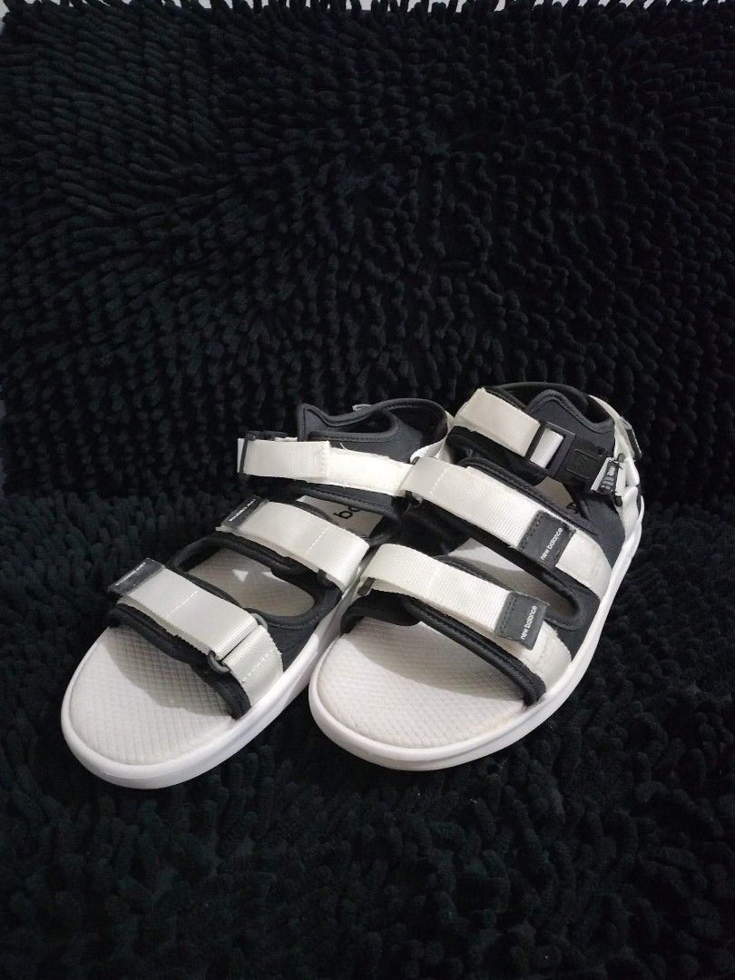NEW BALANCE 750 SLIDES (Category: Slippers & Slides) located in Mandaluyong City. Submitted by letgoph (Listing ID 1382147386, Image 3). Description: PLEASE READ WITH UNDERSTANDING. BRAND: NEW BALANCE Style: 750 Sandals DEETS: For Men Size: US 10 EU 44 on tag Color: Black with white details. Never used. Was just stocked. FLAW/S: Minimal dust and dirt and some yellow stains due to storage. INCLUSION: Sandals only. REASON FOR LETTING IT GO: Declutt