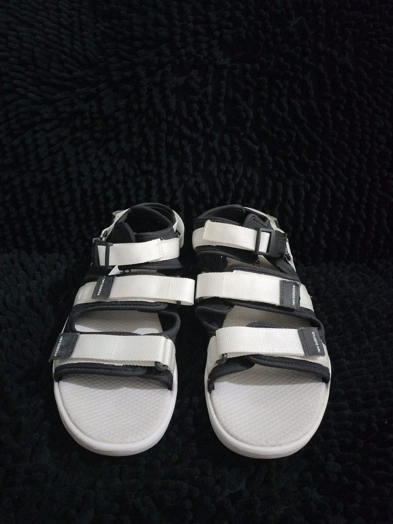 NEW BALANCE 750 SLIDES (Category: Slippers & Slides) located in Mandaluyong City. Submitted by letgoph (Listing ID 1382147386, Image 1). Description: PLEASE READ WITH UNDERSTANDING. BRAND: NEW BALANCE Style: 750 Sandals DEETS: For Men Size: US 10 EU 44 on tag Color: Black with white details. Never used. Was just stocked. FLAW/S: Minimal dust and dirt and some yellow stains due to storage. INCLUSION: Sandals only. REASON FOR LETTING IT GO: Declutt