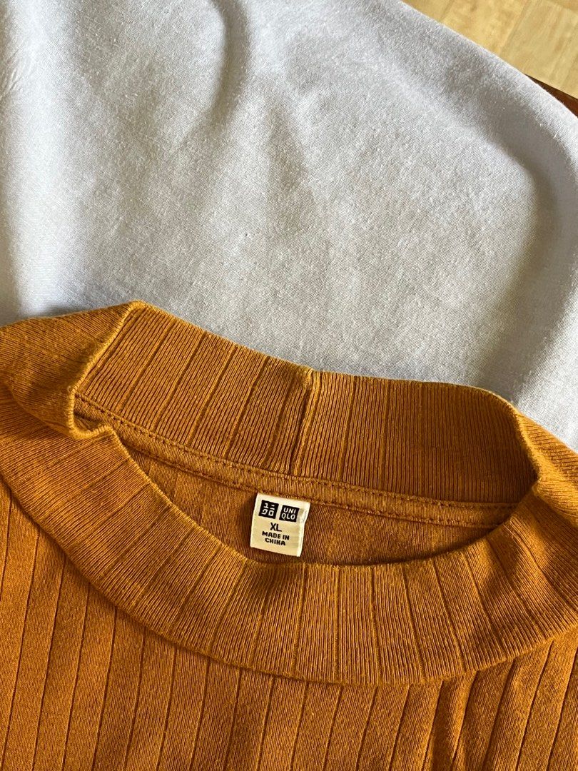 UNIQLO Ribbed Top (Category: Blouses) located in Manila. Submitted by eli555 (Listing ID 1382179831, Image 2). Description: XL on tag but can fit smaller size since its stretchy .