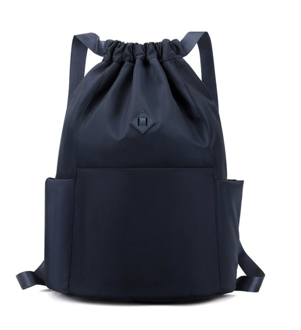 Drawstring backpack bag (Category: Backpacks) located in Singapore. Submitted by peasnbeansprouts (Listing ID 1382402963, Image 1). Description: drawstring backpack in Navy 43x15x30cm bought wrongly.