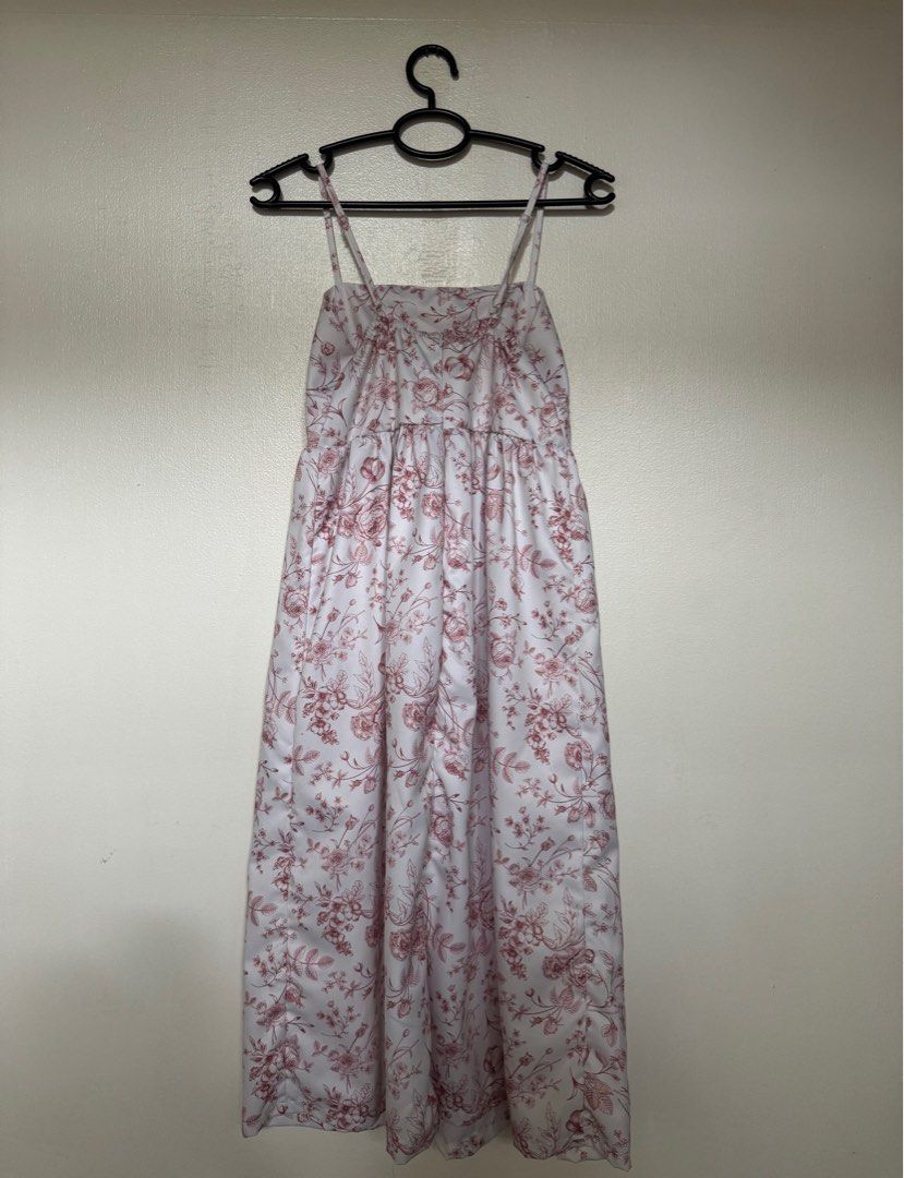 Floral Midi Dress (Category: Dresses) located in Muntinlupa City. Submitted by izzie19 (Listing ID 1382342834, Image 2). Description: Floral spaghetti strap midi dress with soft pink rose print. Adjustable straps, comfy fit, and perfect for daytime or casual occasions. Worn once, still in great condition. .