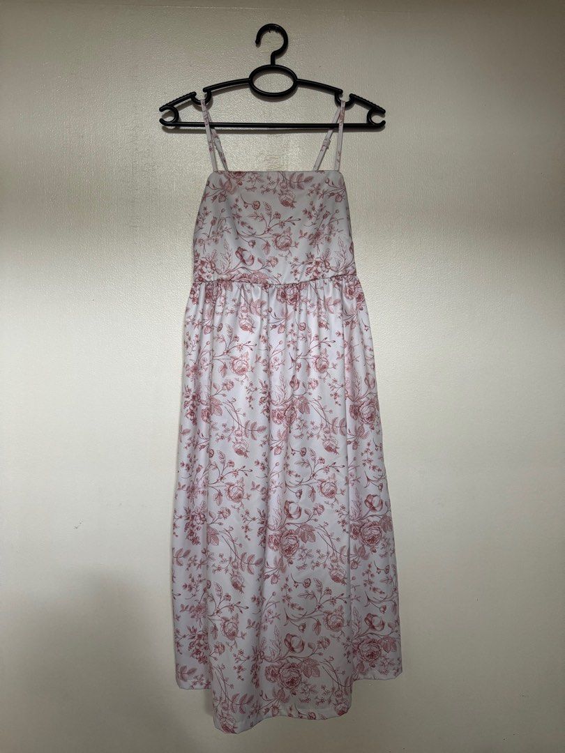 Floral Midi Dress (Category: Dresses) located in Muntinlupa City. Submitted by izzie19 (Listing ID 1382342834, Image 1). Description: Floral spaghetti strap midi dress with soft pink rose print. Adjustable straps, comfy fit, and perfect for daytime or casual occasions. Worn once, still in great condition. .