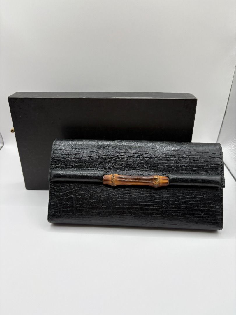 Gucci Bamboo Bifold Wallet (Category: Luxury Bags & Wallets) located in Manila. Submitted by summercookie (Listing ID 1381793547, Image 1). Description: Used Condition 8/10 - sold as is, check photos Back button clasp is broken With box and card Material: Grained leather with gunmetal hardware Measurements: Width: 7.5" x Height: 4" x Depth: 0.75" - single exterior slit pocket with snap closure at front face featuring bamboo adornment - tonal leat