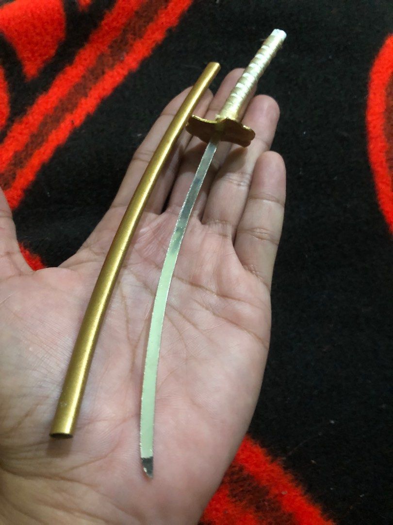 Mini metal katana display figure (Category: Figurines & Statues) located in Quezon City. Submitted by markgolveo (Listing ID 1382469231, Image 2). Description: Mini metal katana display figure.
