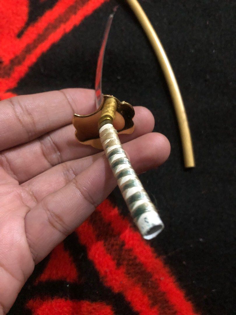 Mini metal katana display figure (Category: Figurines & Statues) located in Quezon City. Submitted by markgolveo (Listing ID 1382469231, Image 3). Description: Mini metal katana display figure.