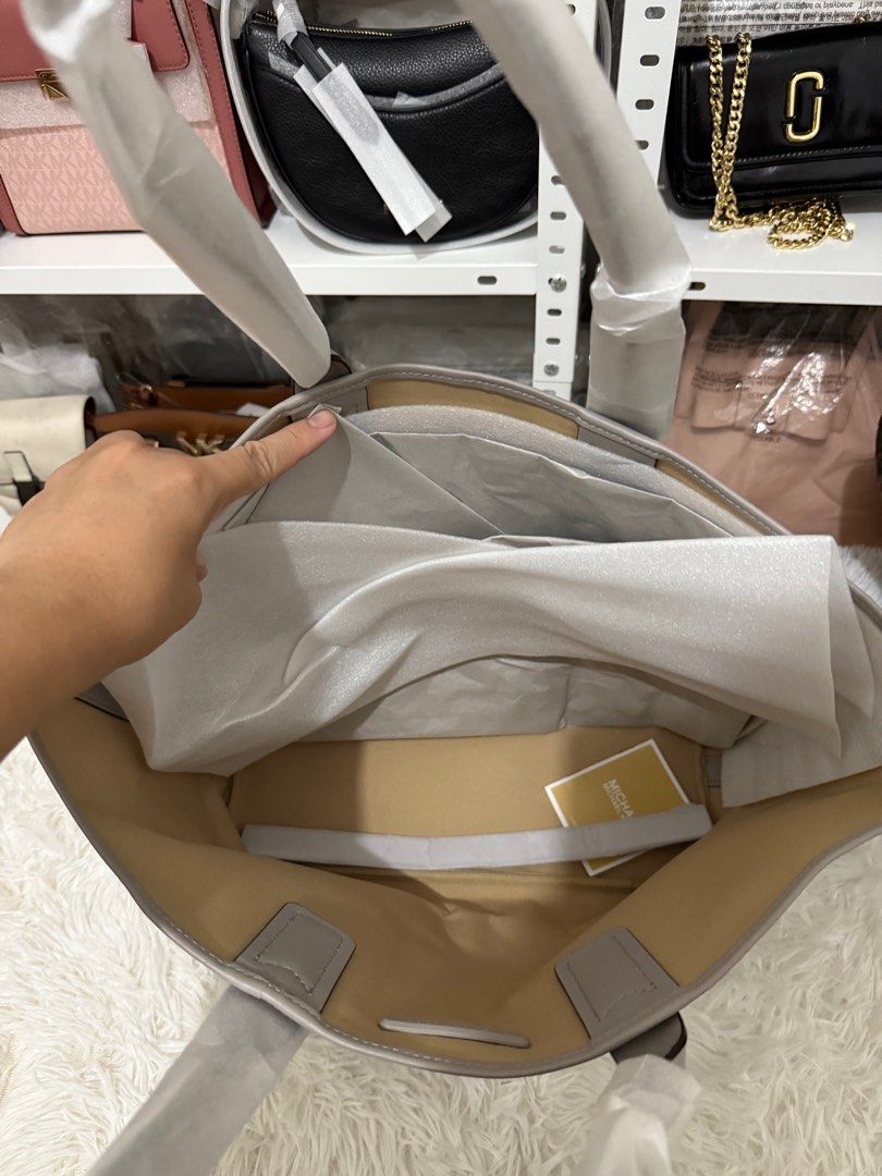 MK jodie large in pearl gray (Category: Luxury Bags & Wallets) located in Bauang. Submitted by chictine (Listing ID 1382468510, Image 3). Description: Brandnew With tag and carecard Source from US 💯% original or moneyback ✅ cod/cop accepted ✅ open for layaway 📍Bauang, La Union For more bags and proof of transactions, please visit my Fb page: Must have shop by Christine.