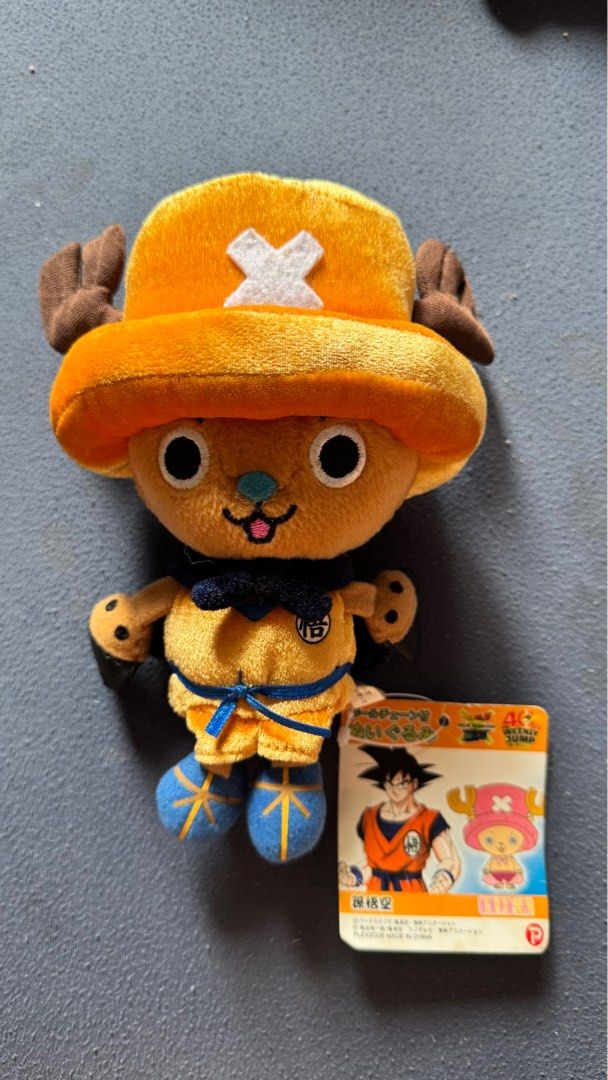 Tony Chopper plush toy dressed in a Goku-inspired outfit (Category: Plushies & Soft Toys) located in Mabalacat. Submitted by fangal_finds (Listing ID 1382338826, Image 1). Description: Tony Tony Chopper plush toy dressed in a Goku-inspired outfit, likely a collaboration celebrating the 40th Weekly Jump anniversary, featuring characters from Dragon Ball Z and One Piece. This specific plush is approximately 8 inches (20 cm) tall. Rare - Collector's