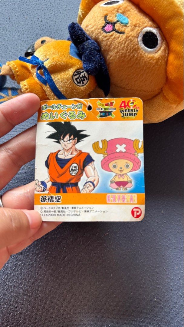 Tony Chopper plush toy dressed in a Goku-inspired outfit (Category: Plushies & Soft Toys) located in Mabalacat. Submitted by fangal_finds (Listing ID 1382338826, Image 2). Description: Tony Tony Chopper plush toy dressed in a Goku-inspired outfit, likely a collaboration celebrating the 40th Weekly Jump anniversary, featuring characters from Dragon Ball Z and One Piece. This specific plush is approximately 8 inches (20 cm) tall. Rare - Collector's