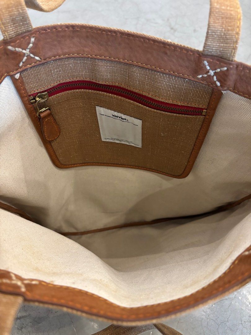 Visvim Basic Tote (L) - Brown (Category: Tote Bags) located in Singapore. Submitted by nonsensical86 (Listing ID 1382363578, Image 3). Description: - Visvim Basic Tote (L) in brown - Canvas exterior - Small interior pocket - Very good condition.