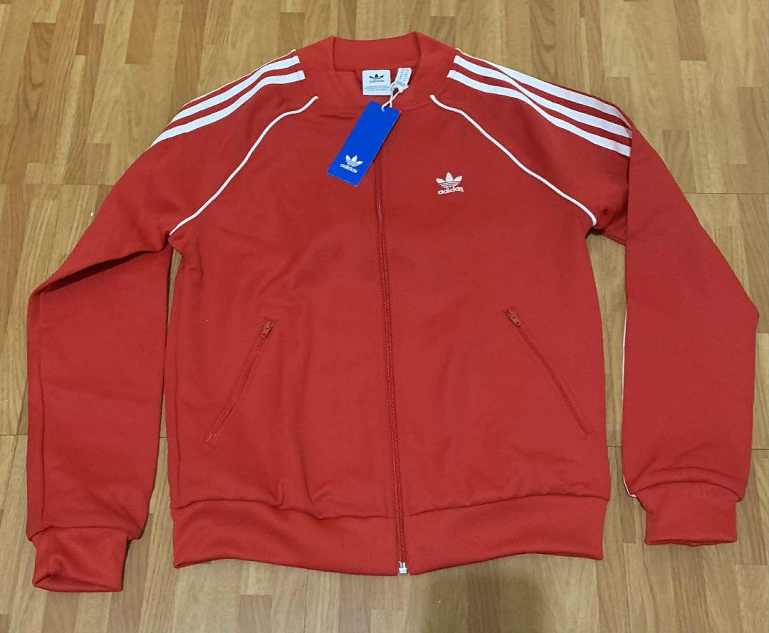 Adidas sst red track set- Negotiable! (Category: Activewear) located in Malabon City. Submitted by yellow1500 (Listing ID 1382680831, Image 2). Description: brand new never worn, natambak lang sa closet jacket is with tag pa pants is wala na kasi nalabhan but di pa rin nagagamit bought from adidas store mismo can fit small to large (baggy to fitted) pls see last pics for orig pric rfs: pls buy na need funds for my cat's vet bills :( i can show pr
