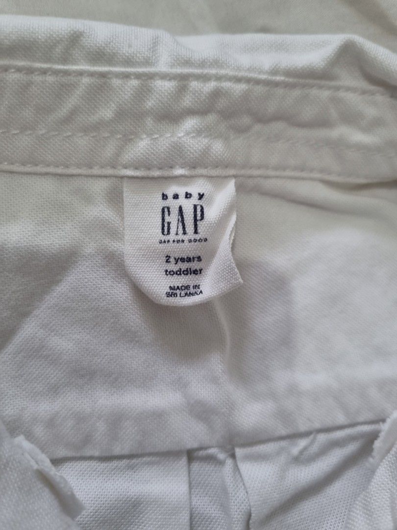 Baby Gap White Longsleeve Polo (Category: Babies & Kids Fashion) located in Quezon City. Submitted by TaraSelling (Listing ID 1382550711, Image 3). Description: Size on tag: 2yo w/ washable stains as seen on photos, due to storage. Hence, selling low..